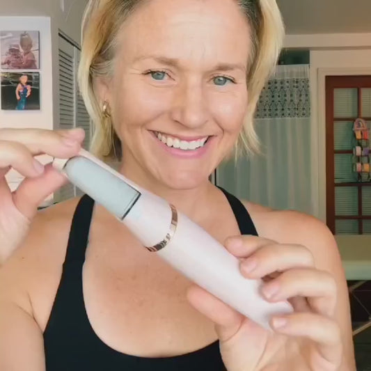 Customer happily using Hyralia Electric Callus Remover on her feet
